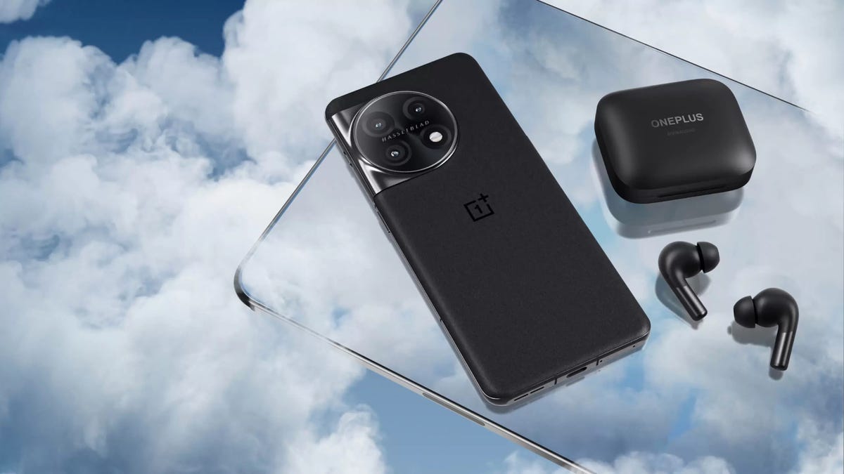 OnePlus Pad tablet with the OnePlus 11 and earbuds on top.